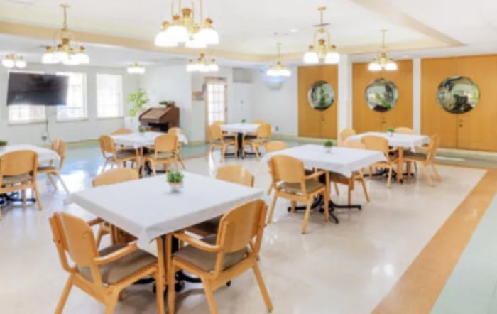 A bright and welcoming dining room with tables and chairs neatly arranged.