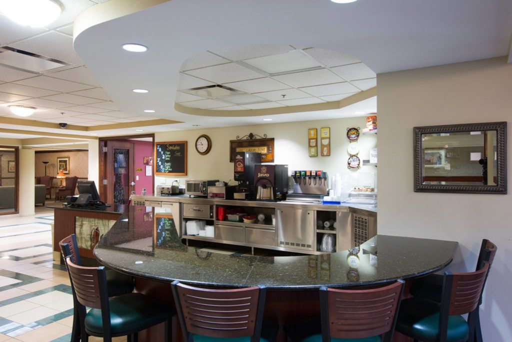 A cozy interior of a caf with a counter and seating area.