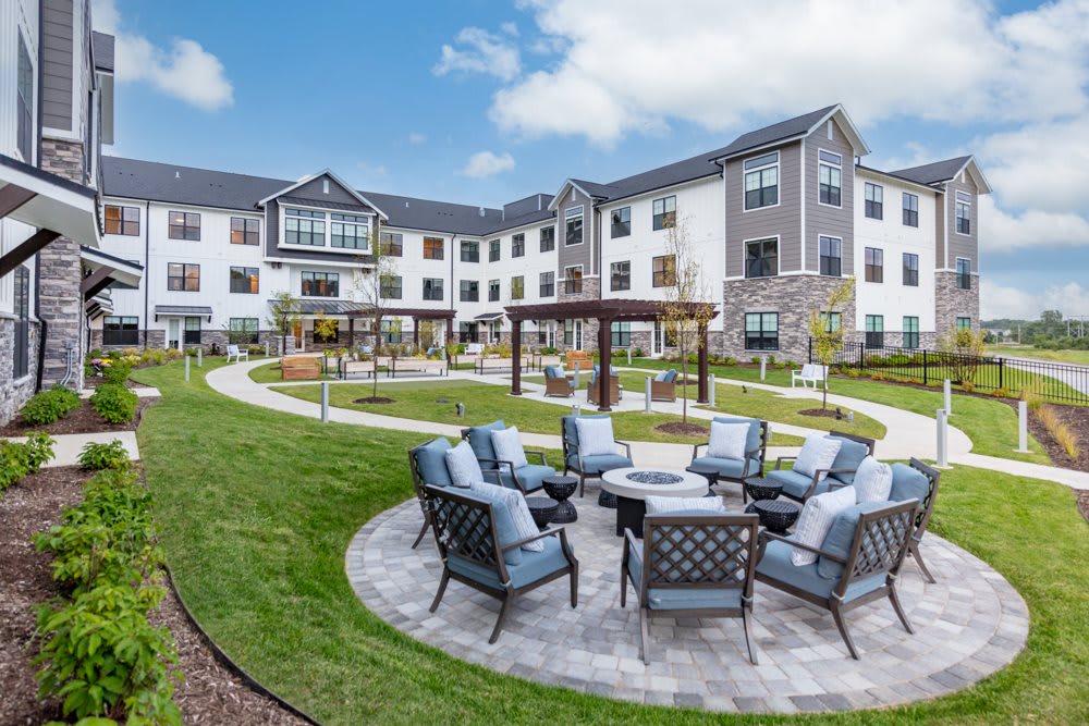 A well-designed courtyard with comfortable outdoor seating at a modern apartment complex.