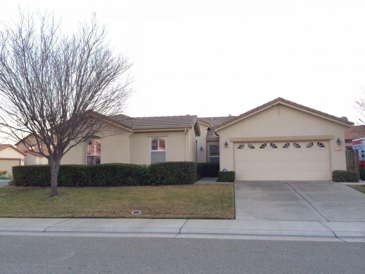 A suburban house with a two-car garage and a small front yard.