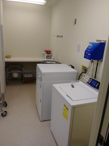 A functional laundry room featuring a washing machine and dryer.