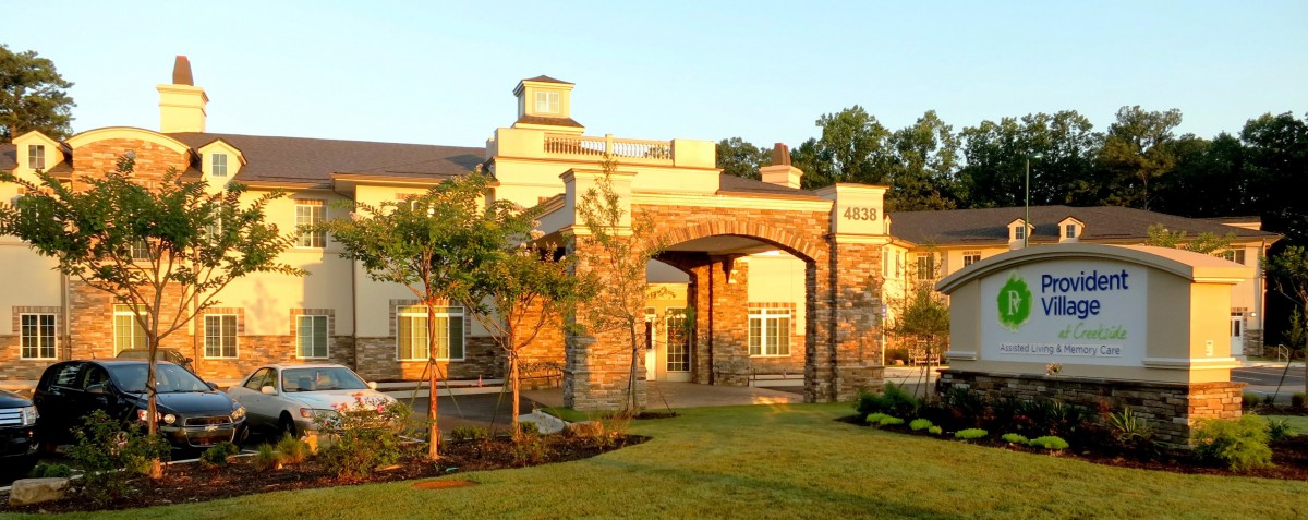 A scenic view of a building entrance bathed in sunlight.