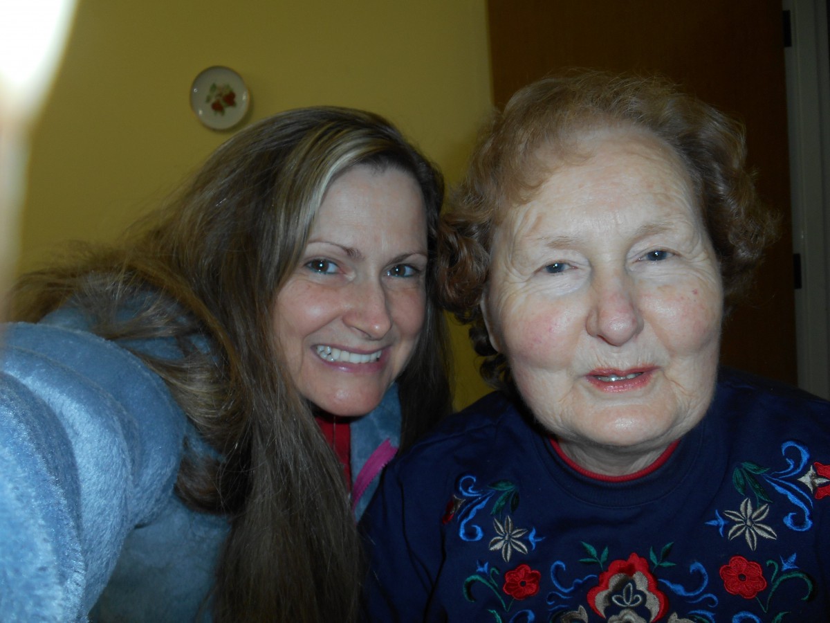 A selfie of two women smiling indoors.