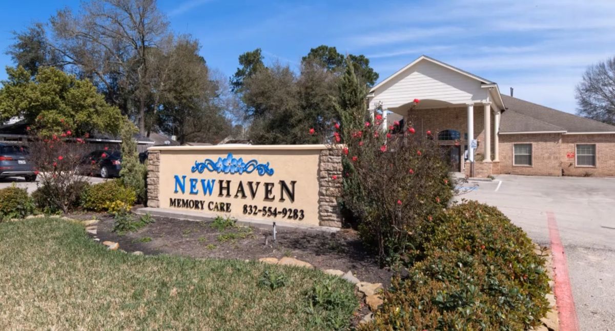 Entrance to Newhaven Memory Care facility with surrounding landscaping.