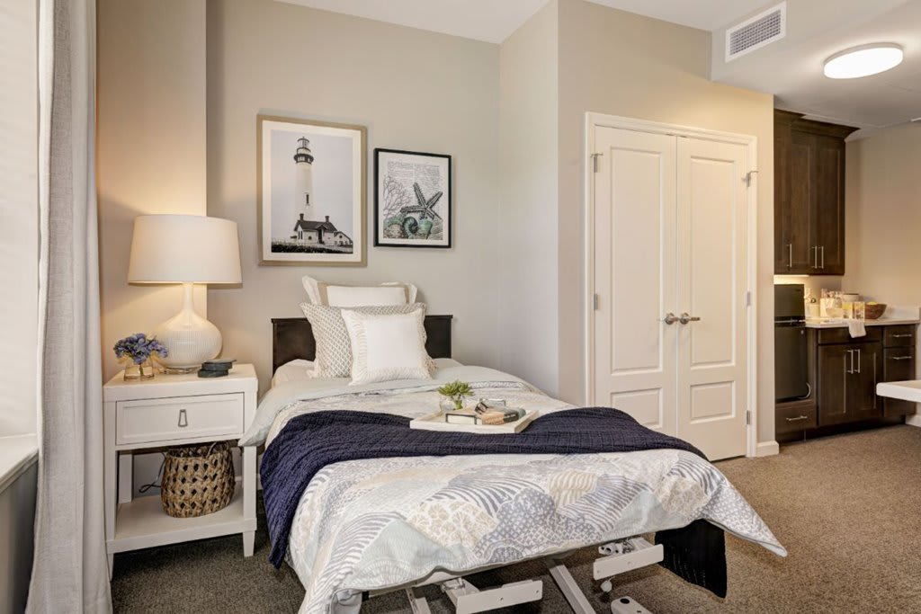 Cozy bedroom with a single bed, stylish decor, and a warm ambiance.