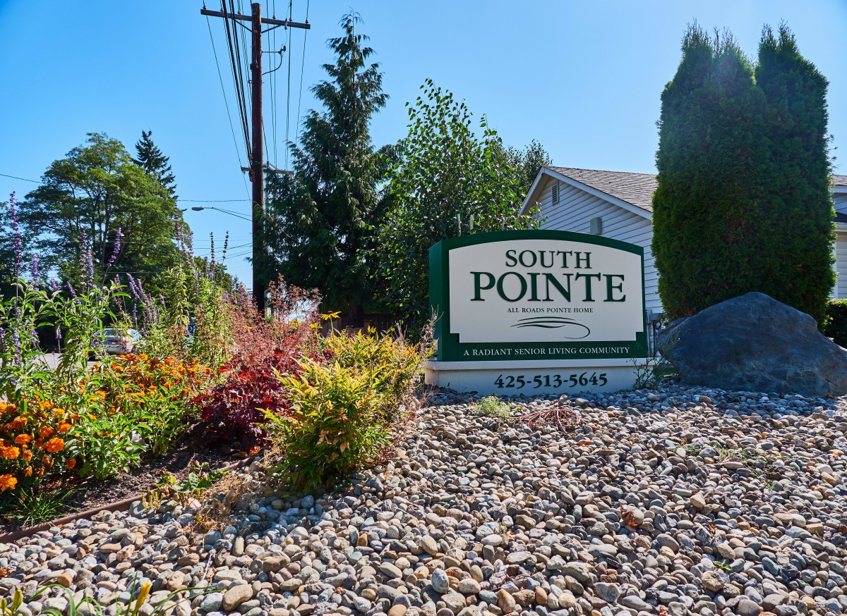 Entrance sign to the South Pointe community surrounded by landscaping.