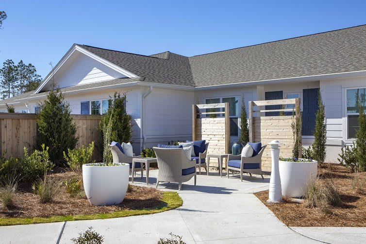 Modern house with a well-designed patio and outdoor seating area.