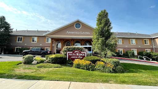 Entrance of Alta Ridge Senior Living facility, featuring well-kept landscaping and signage.