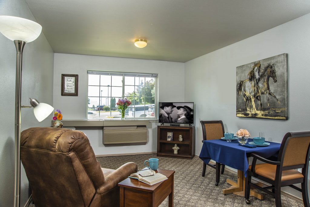 A cozy living room with comfortable seating and a television.