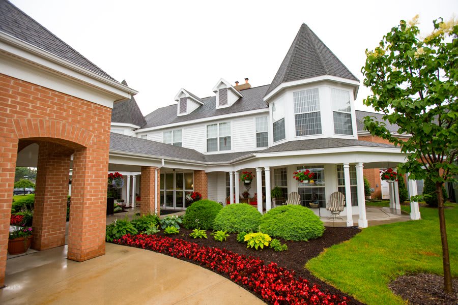 A beautiful residential home with manicured gardens and unique architectural features.