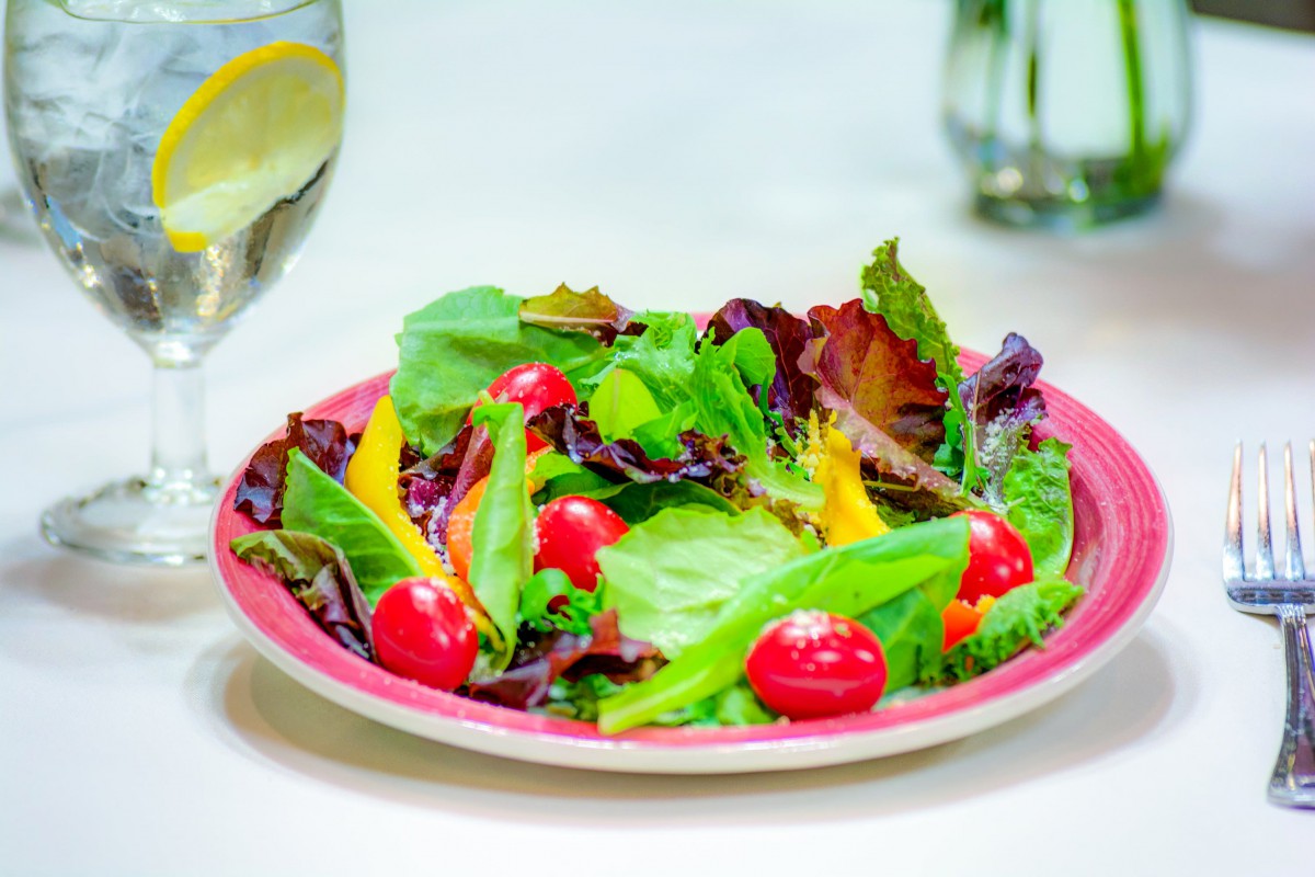A vibrant salad with fresh greens and cherry tomatoes.