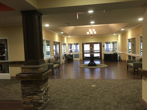 A modern lobby space featuring comfortable seating, warm lighting, and an inviting atmosphere.