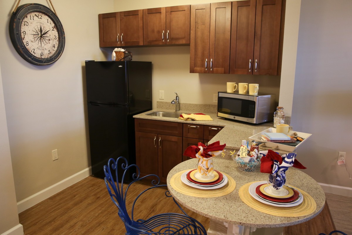 A cozy kitchen setup with dining area and modern appliances.