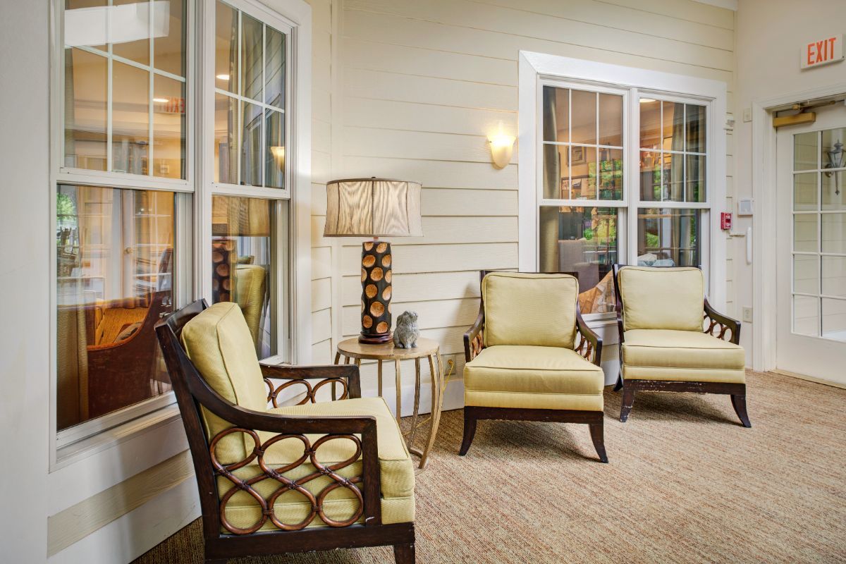A cozy porch area with comfortable seating and soft lighting.