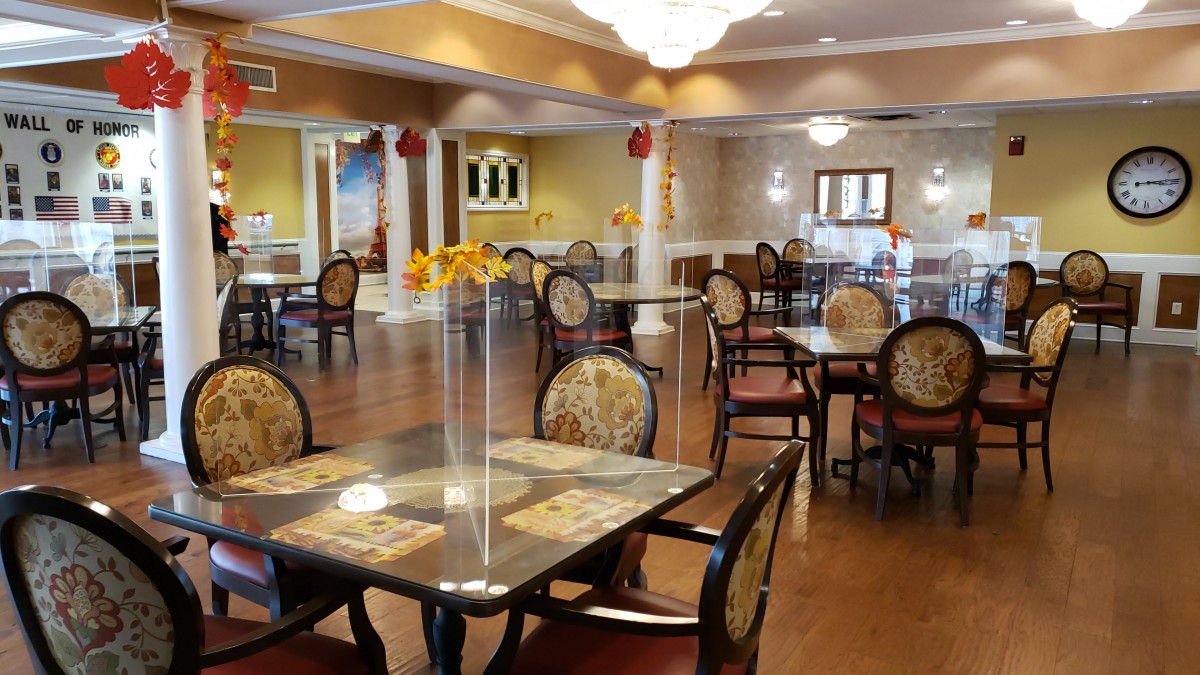 A well-decorated dining area with neatly arranged tables and chairs.