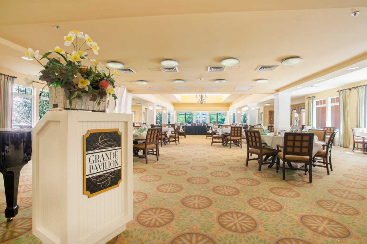 An elegant restaurant dining area with neatly arranged tables and chairs.