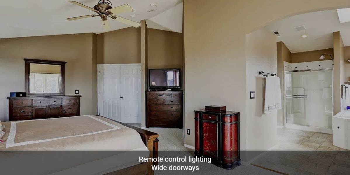 A bedroom with remote control lighting and wide doorways.