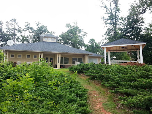 A serene house surrounded by greenery.