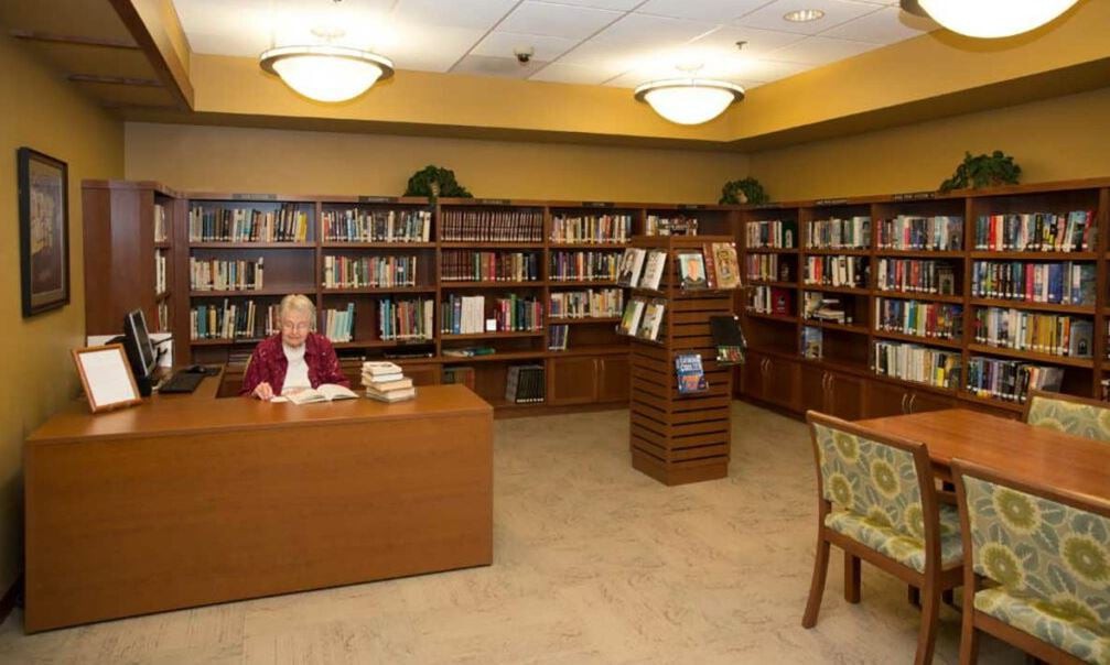 A cozy library with bookshelves and reading areas.