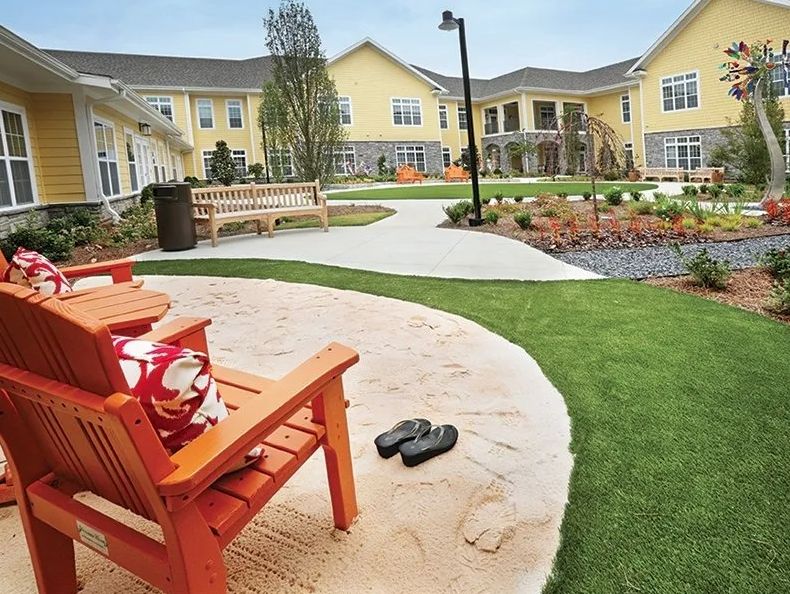 Beautiful outdoor garden area with benches and pathways surrounded by greenery.