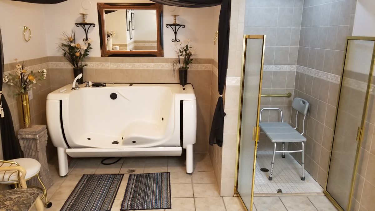 A well-designed bathroom featuring a bathtub and a glass-enclosed shower.