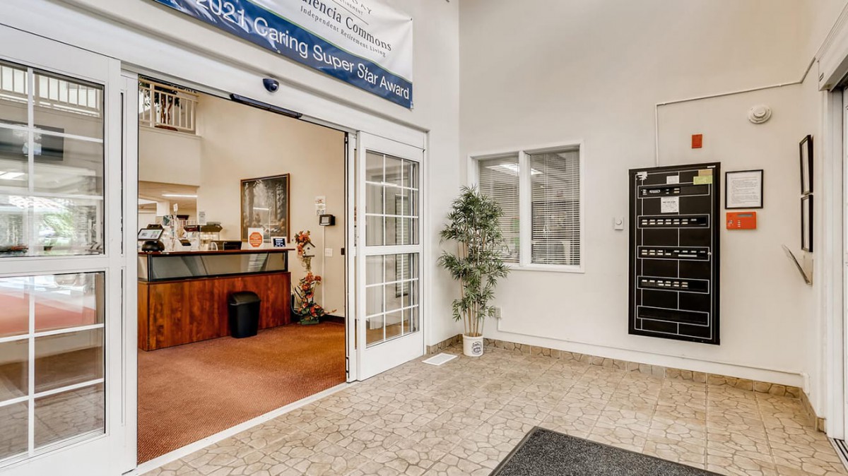 A welcoming office lobby with a reception area and mailboxes.