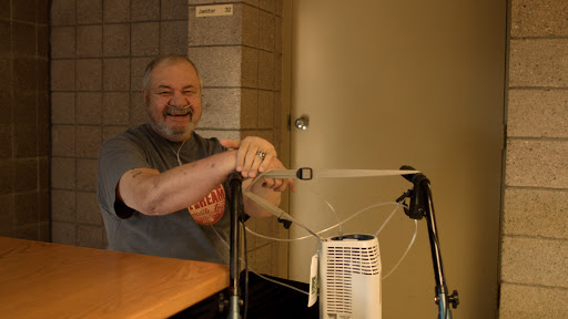 A person enjoying a light-hearted moment indoors.