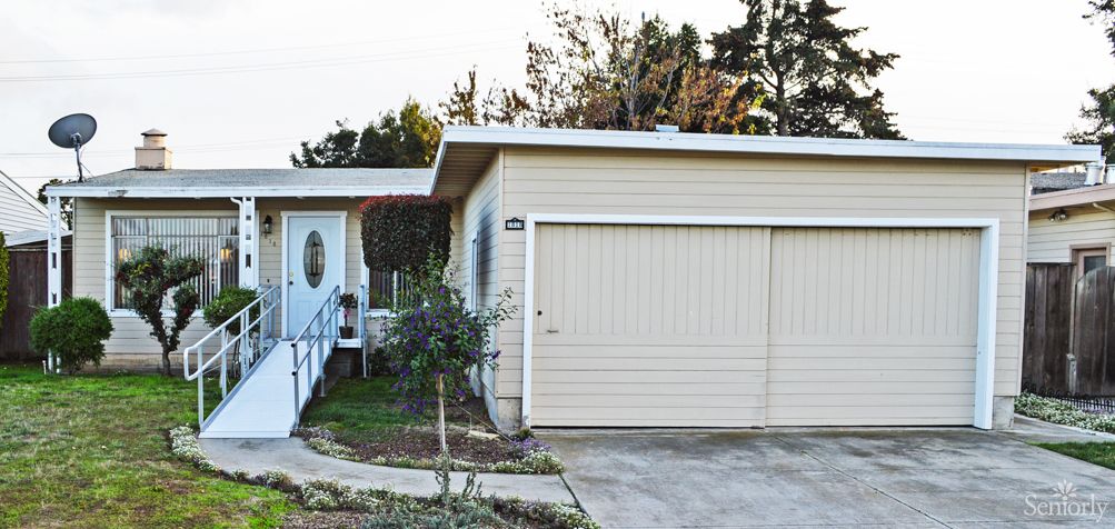 A suburban house with a garage and driveway.