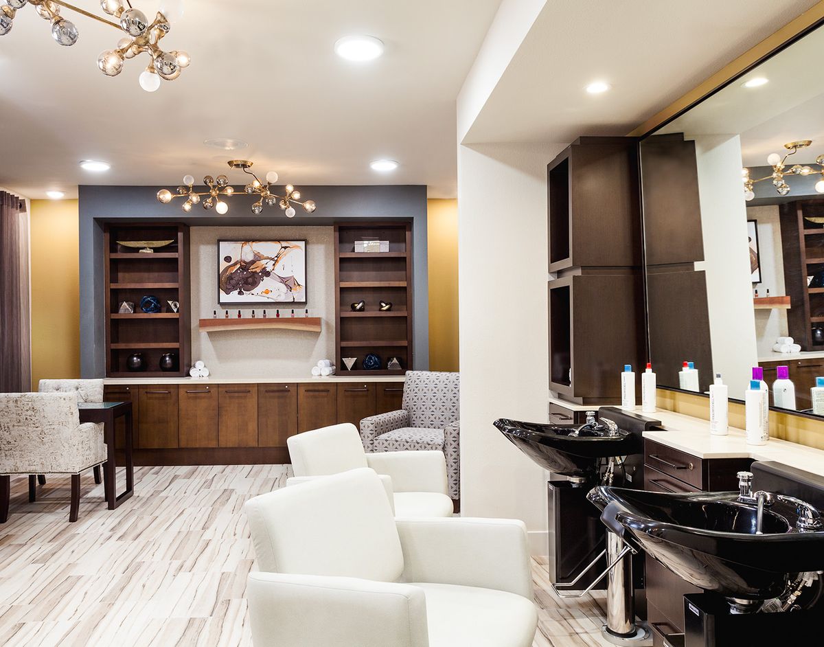 Modern salon interior with stylish furniture and elegant decor.