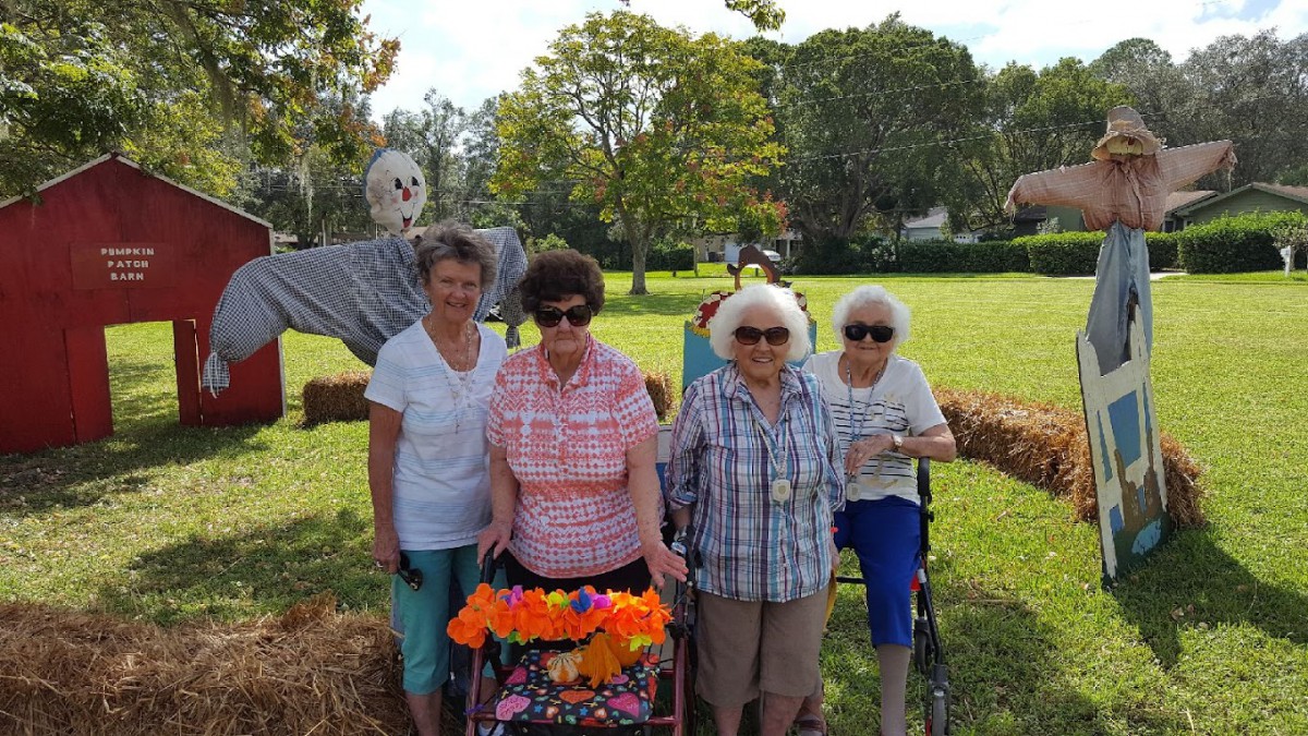 A group of seniors enjoying a sunny day outdoors.