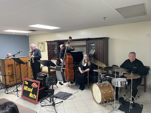 A jazz band performing live, featuring a variety of instruments.