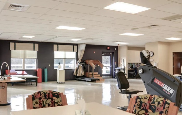 A well-lit office space with furniture and equipment.