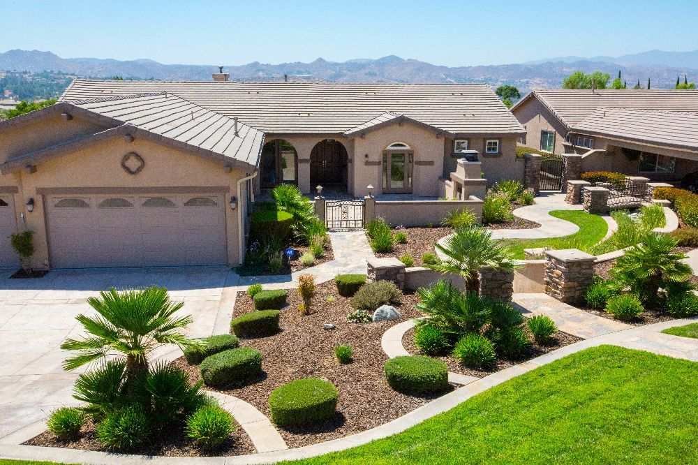 Beautifully landscaped suburban home with desert-style garden.