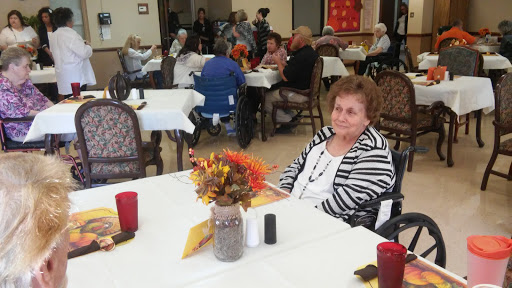 A quiet moment in a community dining area, where residents gather for food and companionship.