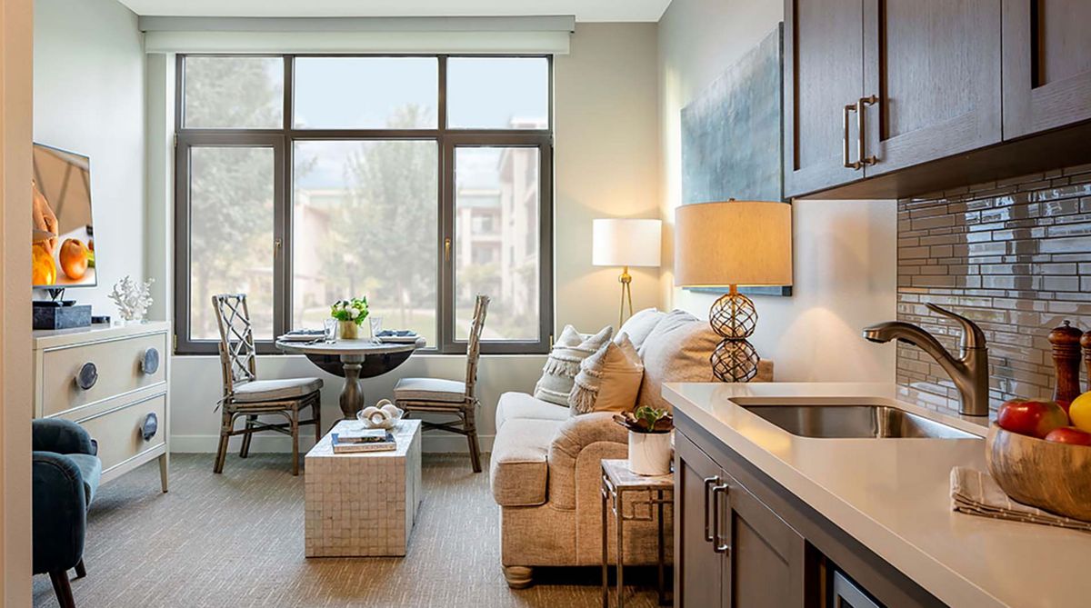 A cozy and modern apartment living room featuring stylish furniture and ample natural light.