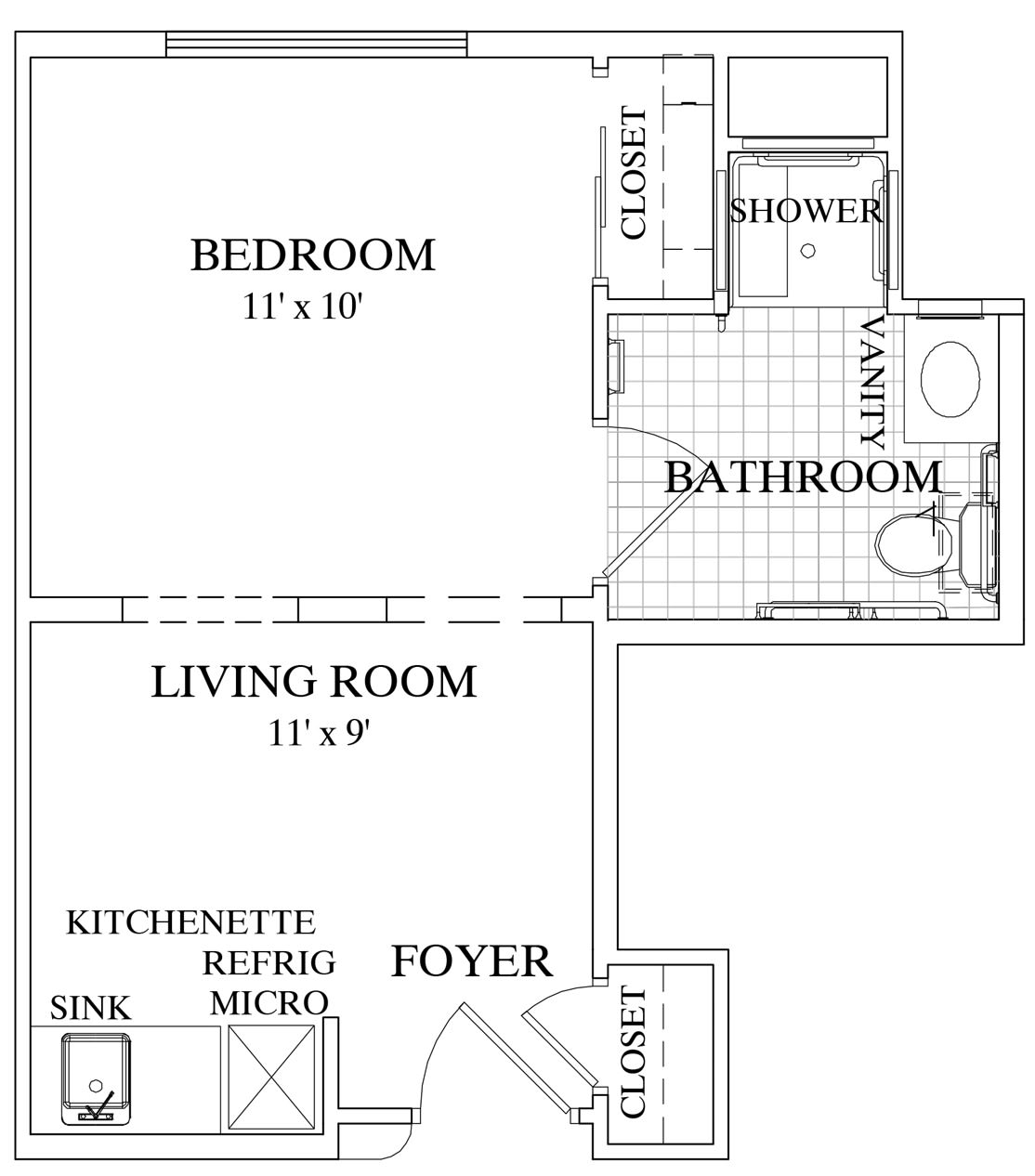 A floor plan of a small apartment featuring one bedroom, a living room, a bathroom with a shower, and a kitchenette.