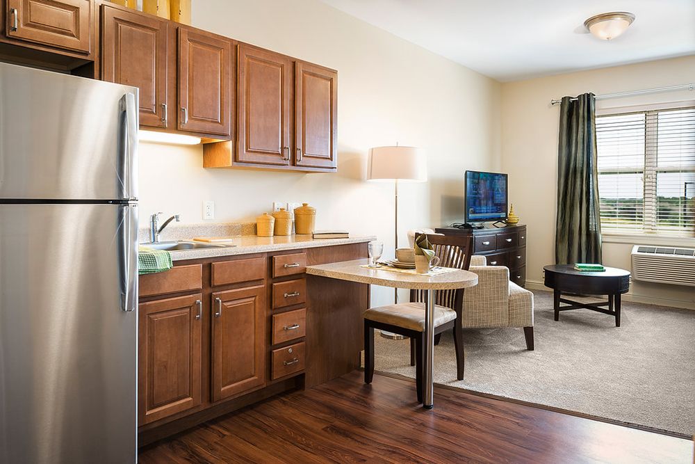 Cozy apartment with a small kitchen and living area.