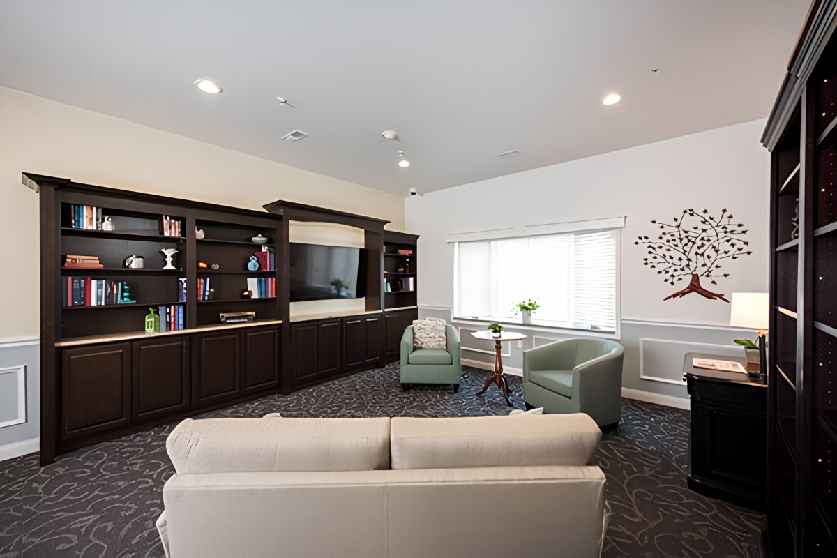 A modern living room with comfortable seating and built-in shelving.