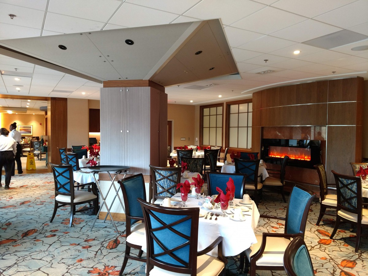 A well-decorated restaurant dining area with set tables and chairs.
