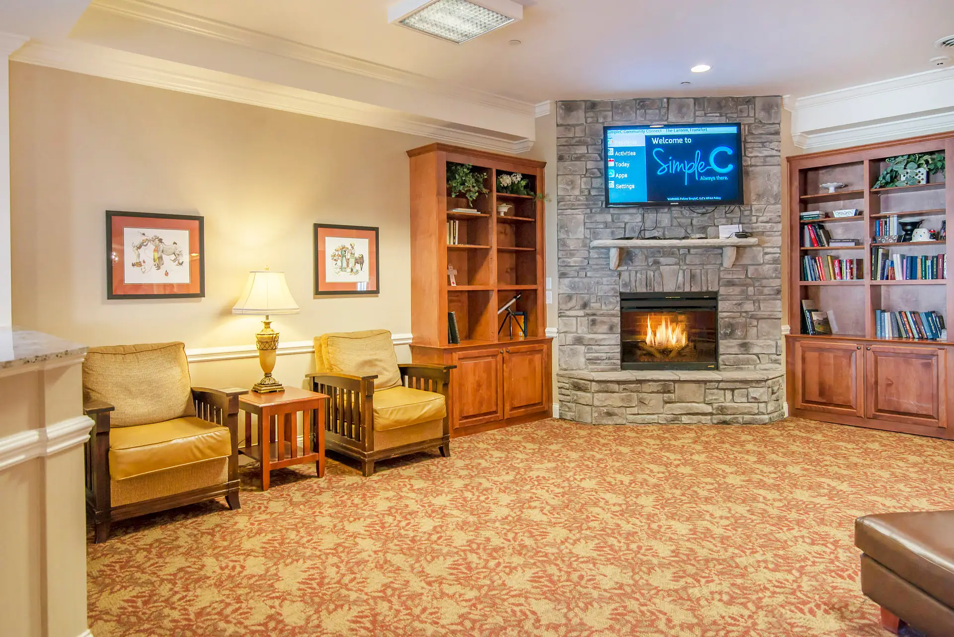 A cozy living room featuring a fireplace, television, and comfortable seating.