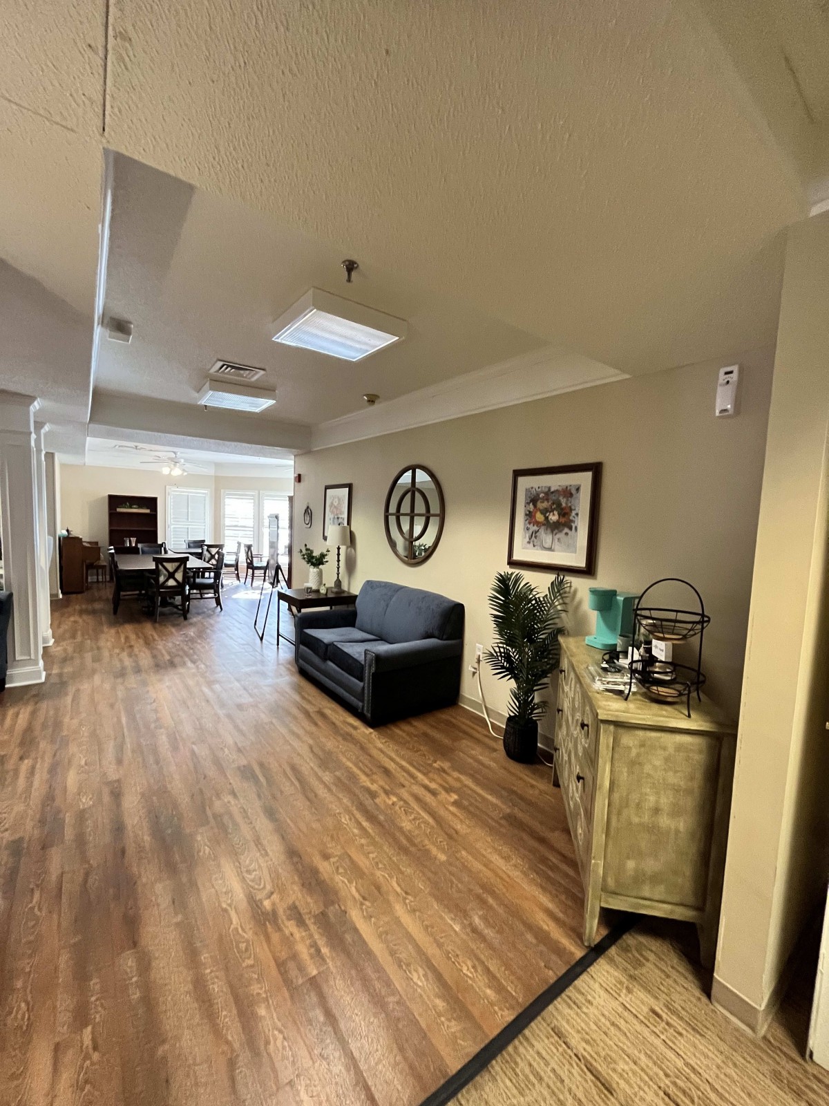 A cozy living space with wooden floors, comfortable seating, and stylish decor.