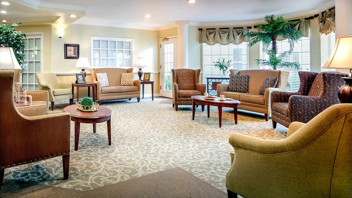 A cozy living room with comfortable seating and natural lighting.