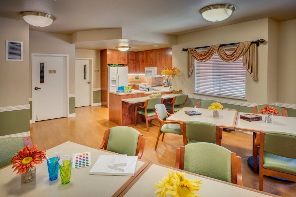 A cozy kitchen and dining area with wooden cabinets and elegant decor.