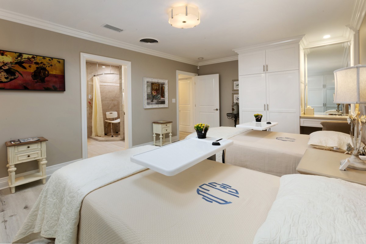 A serene spa room with two therapy beds, designed for relaxation and wellness.