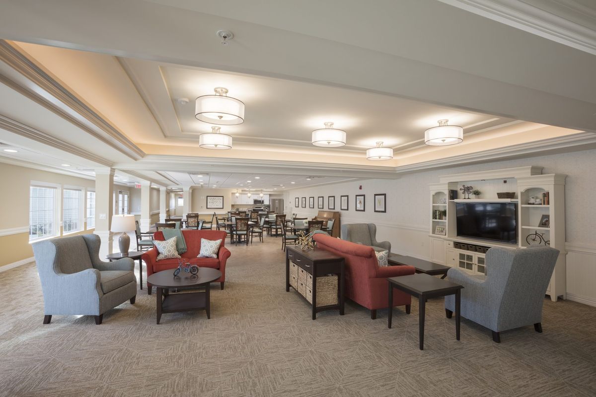 A spacious and elegantly designed lounge area with comfortable seating and ambient lighting.