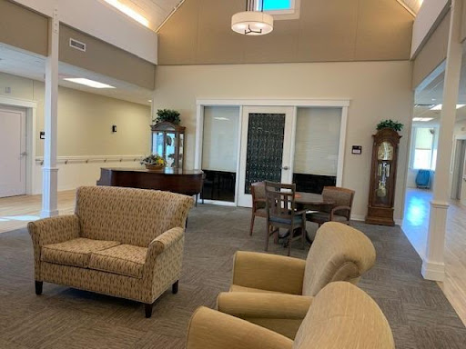 A cozy and inviting lobby area featuring comfortable seating and a warm ambiance.
