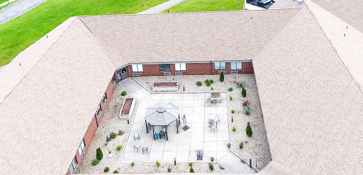 Aerial view of a well-designed courtyard featuring a gazebo, seating areas, and landscaped surroundings.