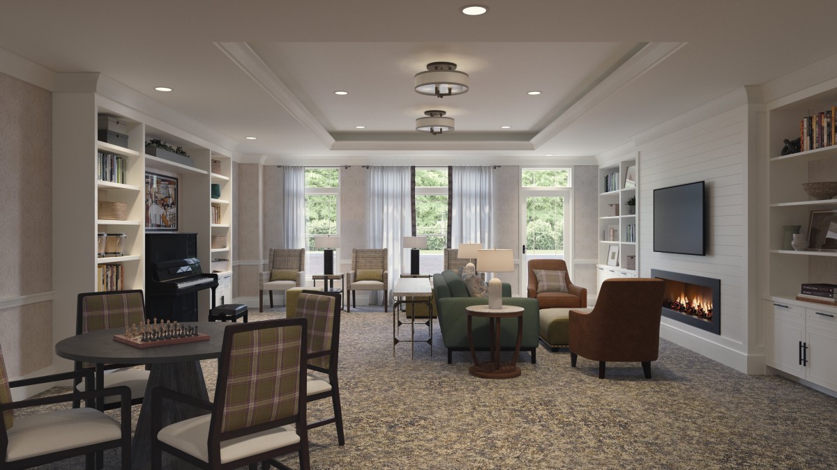A modern living room with comfortable seating and bookshelves.