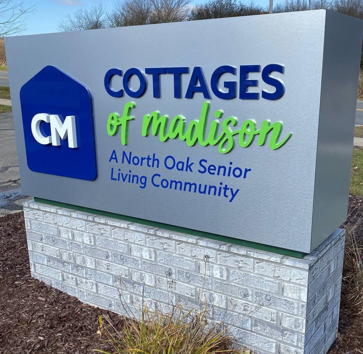 Sign for Cottages of Madison, a North Oak Senior Living Community.