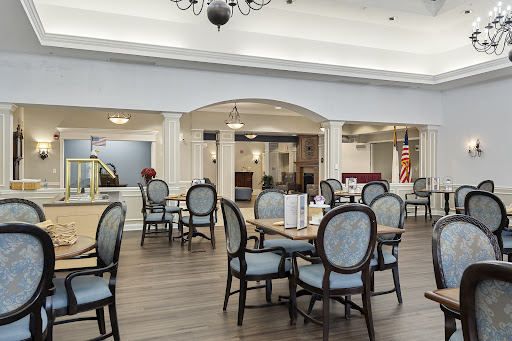 An elegant dining area designed for a senior community, featuring comfortable seating and a welcoming atmosphere.